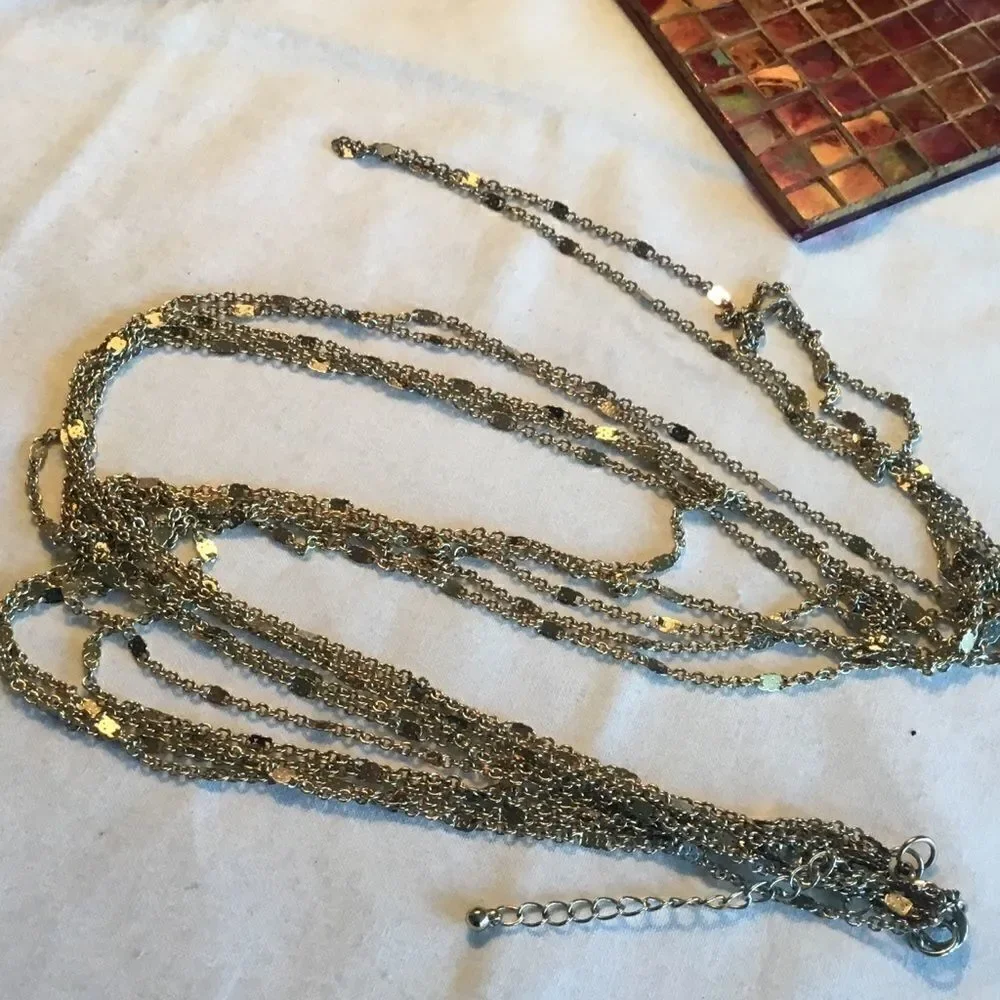 $12 or 3/$25. 5 Strand Goldtone Necklace